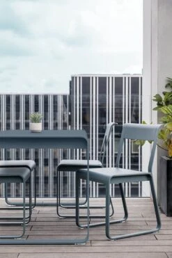 Fermob Bellevie Chair, Acapulco Blue -Garden Furniture Store BELLEVIE GRIS ORAGE PARIS VISUEL2022 ROMAIN RICARD 1 2